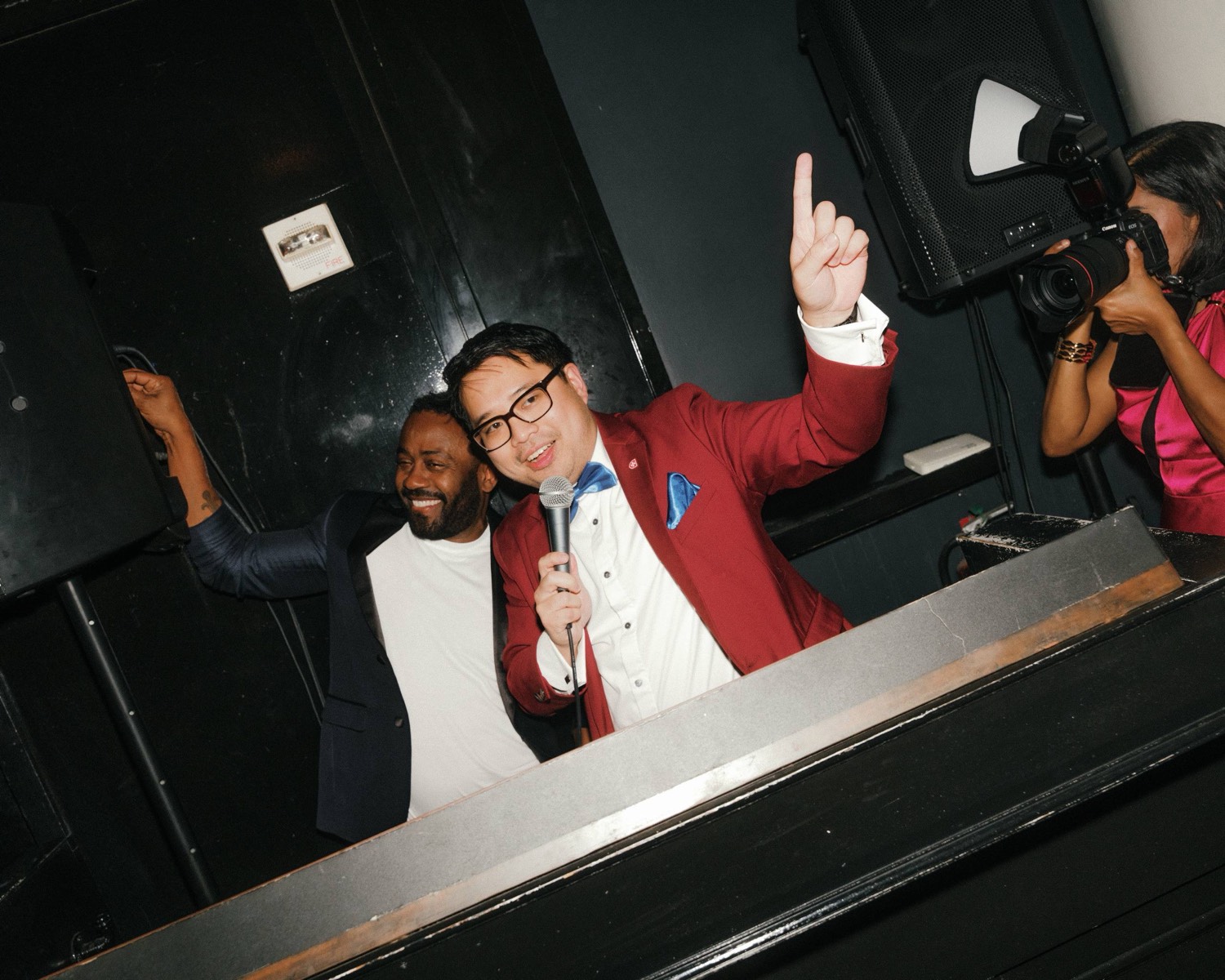 A guest with a microphone at the Birthday Charity Gala.